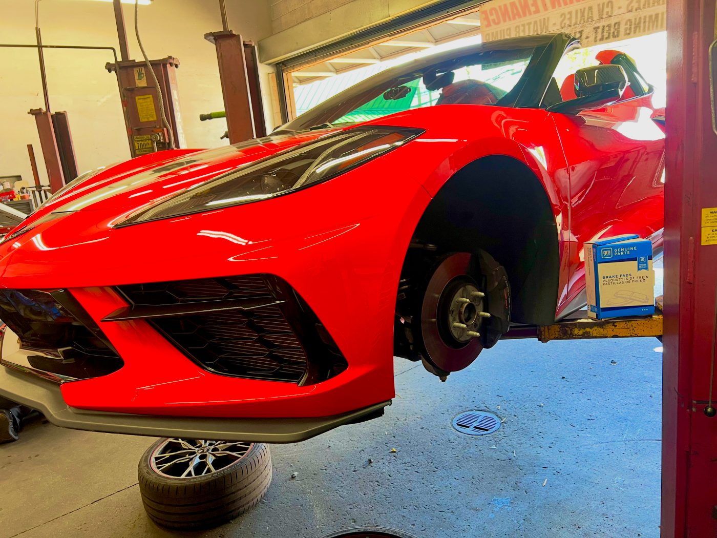 Chevrolet Corvette up on the lift for a brake job at All Model Repair